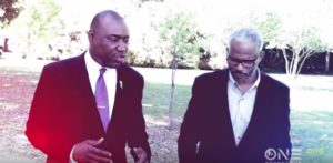 Stil shot from promo video of Attorney Benjamin Crump talking about the law with a guest on Evidence of Innocence.