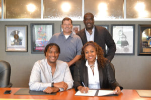 D3 Music Group executives sign with Provident Music Distribution.